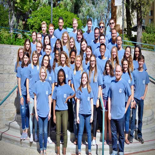 Members of ASCUI standing in their signature blue shirts.